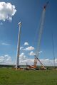 A crane prepares to hoist a wind turbine blade at the Kipeto Wind Park construction site in Kajiado county.